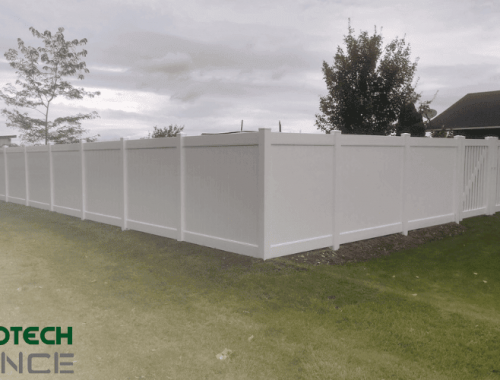 A professionally installed white vinyl fence by Protech Fence, showcasing quality craftsmanship and security, representing one of the top fence companies in Ammon, ID.