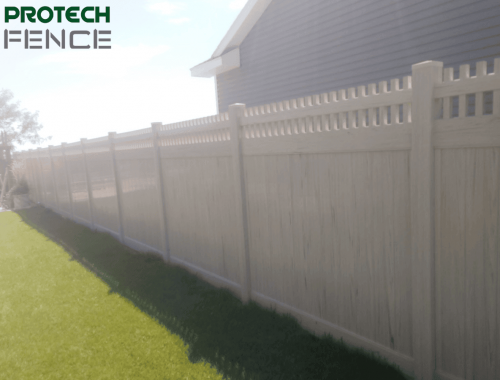 A professionally installed beige vinyl fence by Protech Fence, showcasing durability and privacy, representing quality affordable fence installation services in Ammon, Idaho.