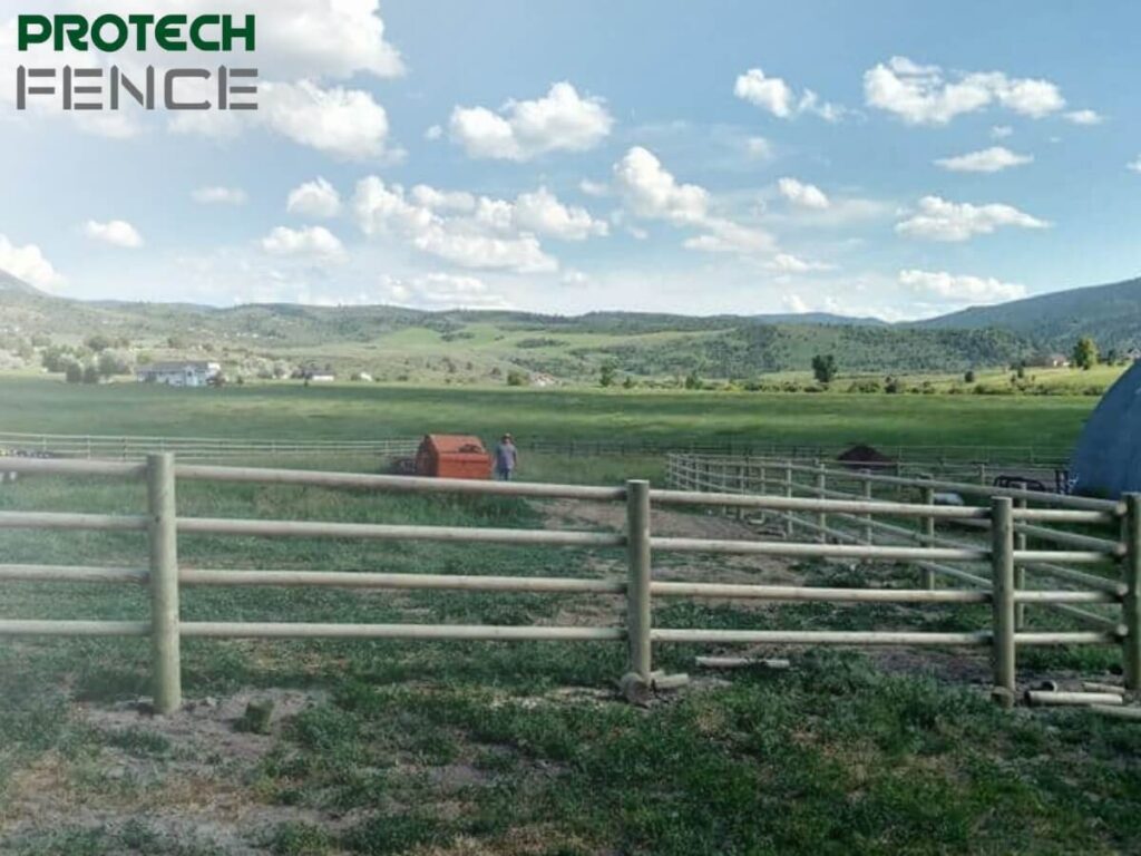 Scenic view of Southeast Idaho countryside with a newly installed wooden fence by local wood fence gate installers near me, showcasing quality craftsmanship and beautiful natural surroundings.